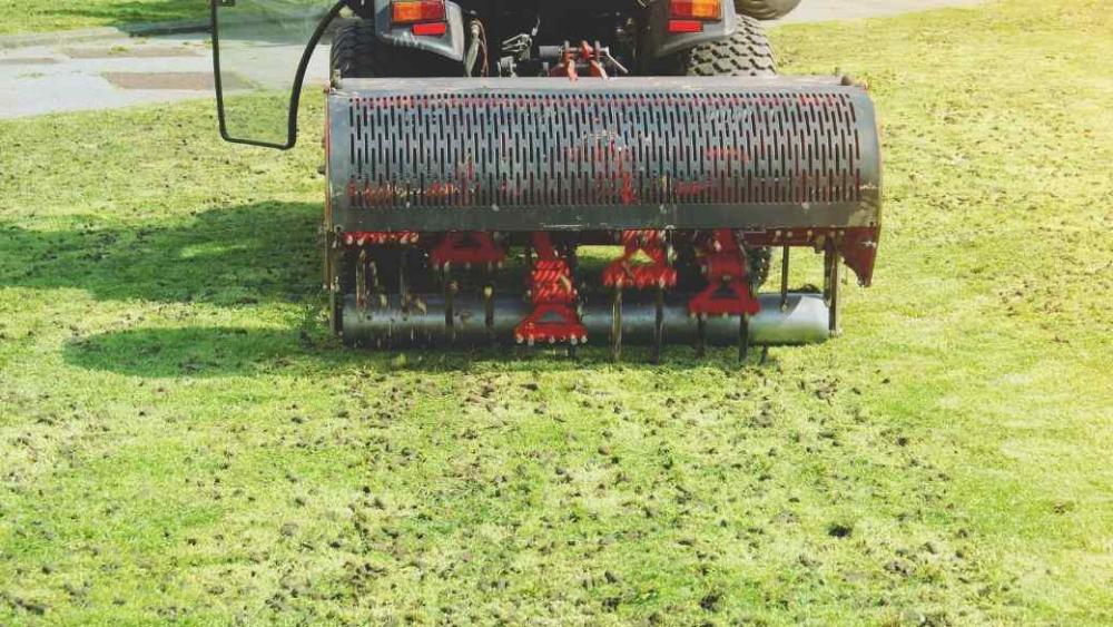 A plug aerator aerating a lawn.